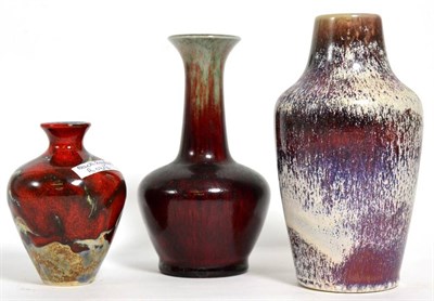 Lot 174 - Cobridge pottery: a red flambe glazed vase with slender neck and a mottled glaze vase, shape number