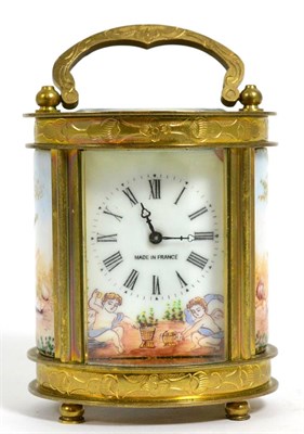 Lot 183 - A miniature French brass and porcelain timepiece