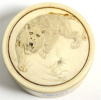 Lot 192 - A Japanese Meiji period carved ivory box, the cover depicting a tiger