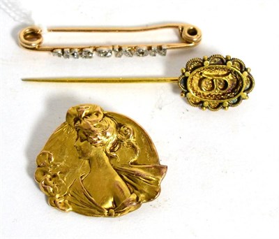 Lot 211 - A diamond set 'NOV.25TH' bar brooch, an Art Nouveau maiden oria brooch and a stick pin (3)