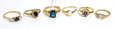 Lot 213 - A 9ct gold blue topaz ring and five other 9ct gold rings