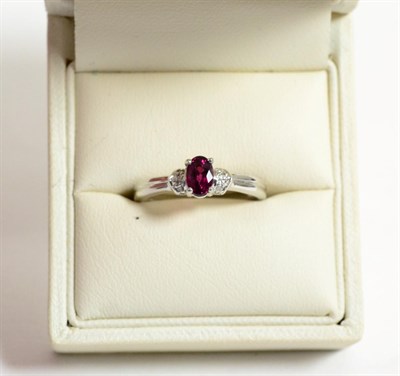 Lot 235 - A 9ct white gold rubelite and diamond ring, finger size N1/2