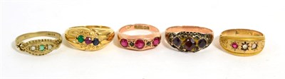 Lot 239 - Two 9ct gold gem set antique rings, a garnet set ring, a 9ct gold emerald ring and a gem set...