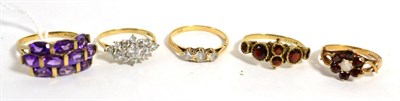 Lot 246 - A 9ct gold amethyst ring, finger size Q1/2 and four other 9ct gold gem set rings (5)