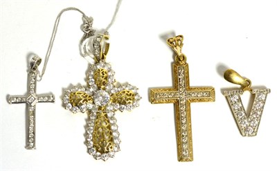 Lot 250 - Three 9ct gold cross pendants and a 9ct gold 'V' pendant