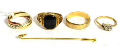 Lot 254 - A 9ct three colour gold band ring, a 9ct gold band ring, a 9ct gold signet ring, a diamond ring...