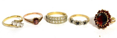 Lot 259 - A 9ct gold garnet cluster ring, finger size K1/2 and four other 9ct gold gem set rings (5)