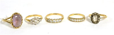 Lot 260 - A 9ct gold rose quartz ring, finger size T and four 9ct gold gem set rings (5)