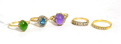 Lot 262 - A jade ring, finger size Q, a 9ct gold cabochon amethyst ring, finger size R/12 and three 9ct...