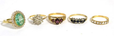 Lot 273 - A 9ct gold fluorite cluster ring, finger size U and four other 9ct gold gem set rings (5)