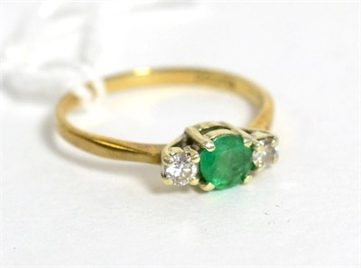 Lot 274 - A 9ct gold emerald and diamond three stone ring, finger size L, total estimated diamond weight 0.10