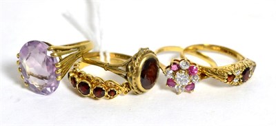 Lot 279 - A 9ct gold amethyst ring, finger size M1/2 and four other 9ct gold gem set rings (5)