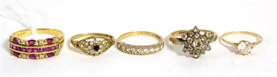 Lot 280 - A 9ct gold ruby and diamond band ring, finger size T and four 9ct gold gem set rings (5)