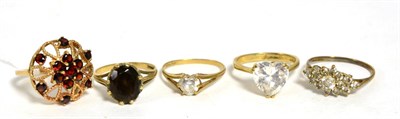 Lot 286 - A 9ct gold garnet cluster ring, finger size K1/2 and four 9 carat gold gem set rings (5)