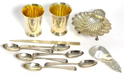 Lot 298 - A pair of silver beakers, Birmingham 1972; a shell shaped silver dish, 1979; a silver caddy...