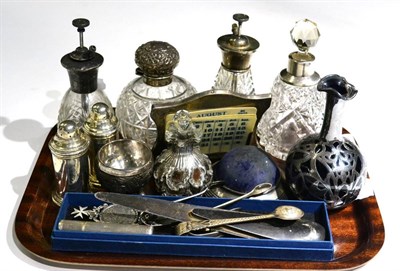 Lot 306 - Mixed silver items to include: a desk calendar; circular pin cushion; two paper knives; a white...