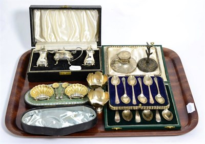 Lot 337 - Assorted silver comprising a cased three piece condiment set, a cased pair of shelf form salts, two