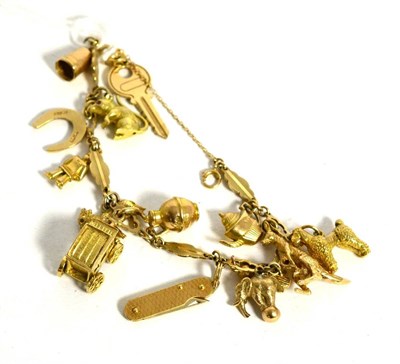 Lot 348 - A charm bracelet with various 9ct/18ct and other unmarked charms