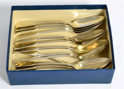 Lot 350 - A set of six silver fiddle pattern dessert spoons, London hallmark; and two other part sets, London