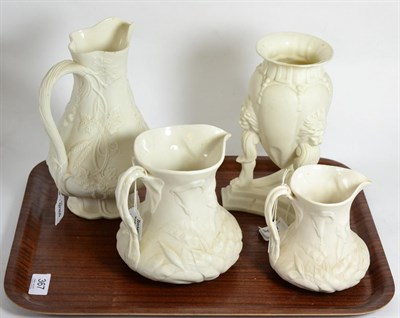 Lot 367 - Two Parian lilly pattern jugs stamped 'Livesley Powell & Co', another Parian jug and a tripod...