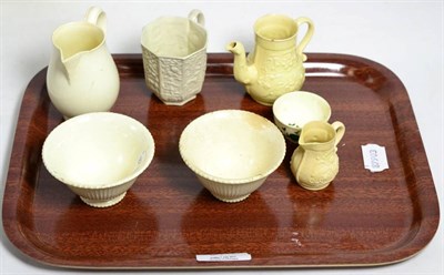 Lot 374 - Saltglaze cup, two creamware jugs, miniature coffee pot and three bowls