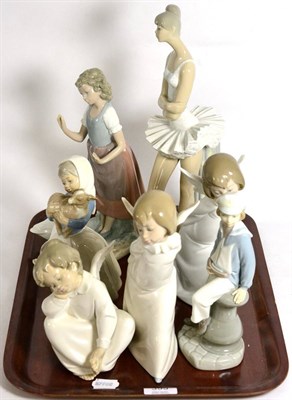 Lot 399 - A group of four Lladro figures and three Nao examples (7)