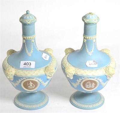 Lot 403 - A pair of 19th century Wedgwood Jasperware bottle form decanters with stoppers (some damage) of...