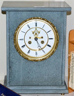 Lot 410 - A grey slate striking mantel clock