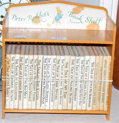 Lot 412 - Peter Rabbits book shelf with twenty three volumes