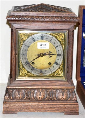 Lot 413 - A carved oak quarter striking table clock, retailed by J Dwerryhouse Liverpool, movement...