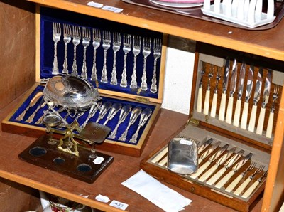 Lot 433 - A cased set of fruit knives and forks, a cased set of fish cutlery, postal scales, hips flask and a