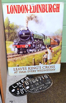 Lot 439 - A reproduction Flying Scotsman enamel sign, together with two locomotive plates (3)