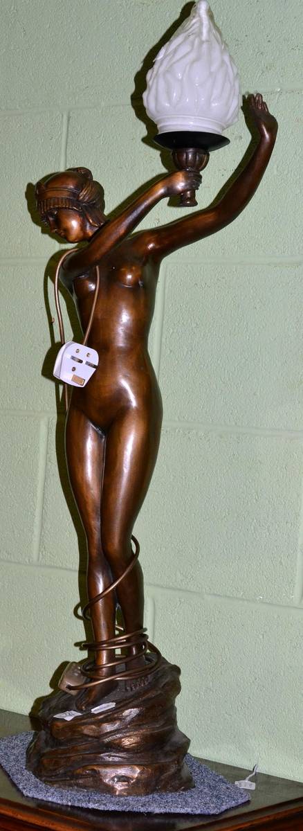 Lot 454 - A reproduction spelter table lamp in the form of a nude female, with glass shade