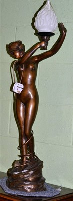 Lot 454 - A reproduction spelter table lamp in the form of a nude female, with glass shade