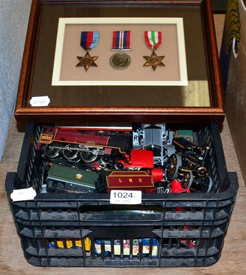 Lot 1024 - A group of assorted collectables including a framed group of medals, Hornby locomotives etc