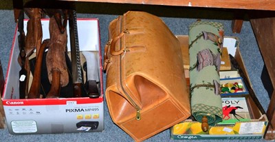 Lot 1043 - Assorted collectables to include racing games, an American leather gladstone bag, African carvings