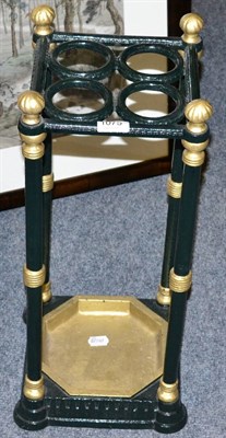 Lot 1075 - A green and gold painted cast iron square stick stand