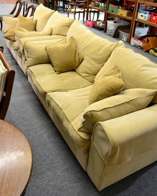 Lot 1091 - A modern cream three seater and two seater sofa