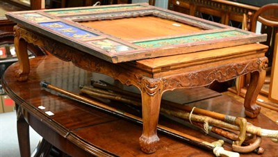 Lot 1106 - A Chinese hardwood low table with dragon path carved apron and a carved and painted screen...