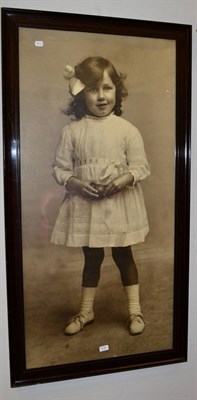 Lot 1110 - A large framed photograph of a girl