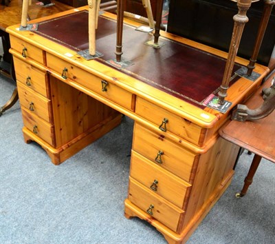 Lot 1117 - A reproduction pine twin pedestal desk