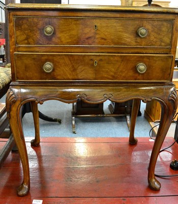 Lot 1127 - A 1920's walnut two drawer cutlery chest