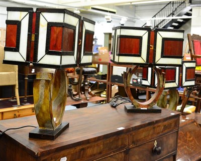 Lot 1129 - A set of three modern table lamps each with coloured glass shades