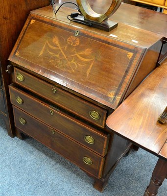 Lot 1130 - An Edwardian cross banded and inlaid mahogany bureau of small proportions