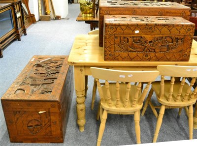 Lot 1142 - A set of three carved oriental camphor chests