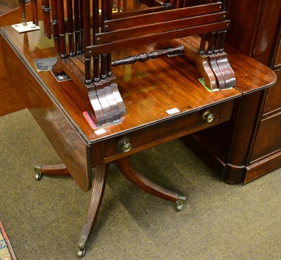 Lot 1232 - A mahogany Pembroke table on turned supports and four reeded legs