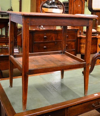 Lot 1242 - A late George III fruitwood two tier table