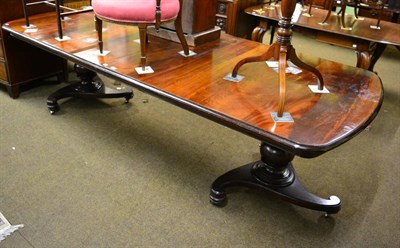 Lot 1246 - A reproduction mahogany twin pillar extending dining table with two additional leaves