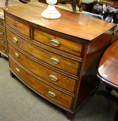 Lot 1249 - A 19th century cross banded mahogany bow front four height chest of drawers