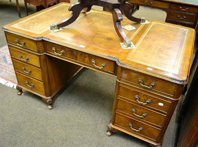 Lot 1251 - A reproduction desk with leather insert